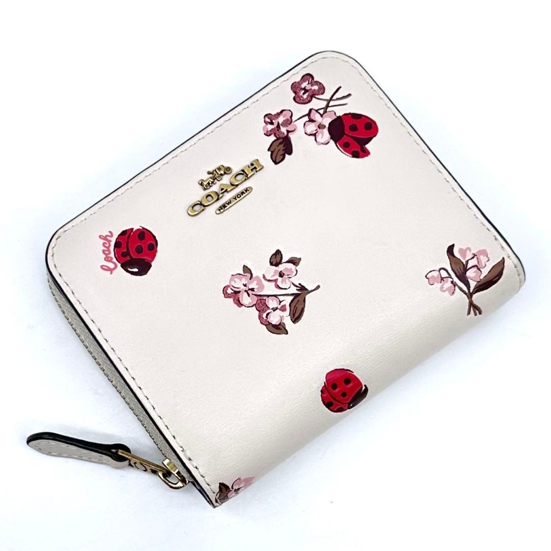美品✨COACH コーチ 二つ折り財布 レザー てんとう虫 フローラル 日本限定