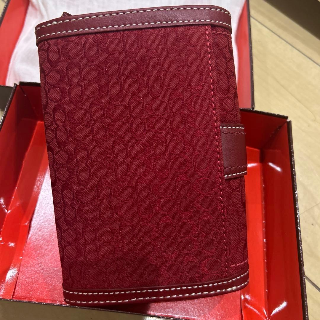 COACH 赤い二つ折り財布 折りたたみ財布 シグネチャー