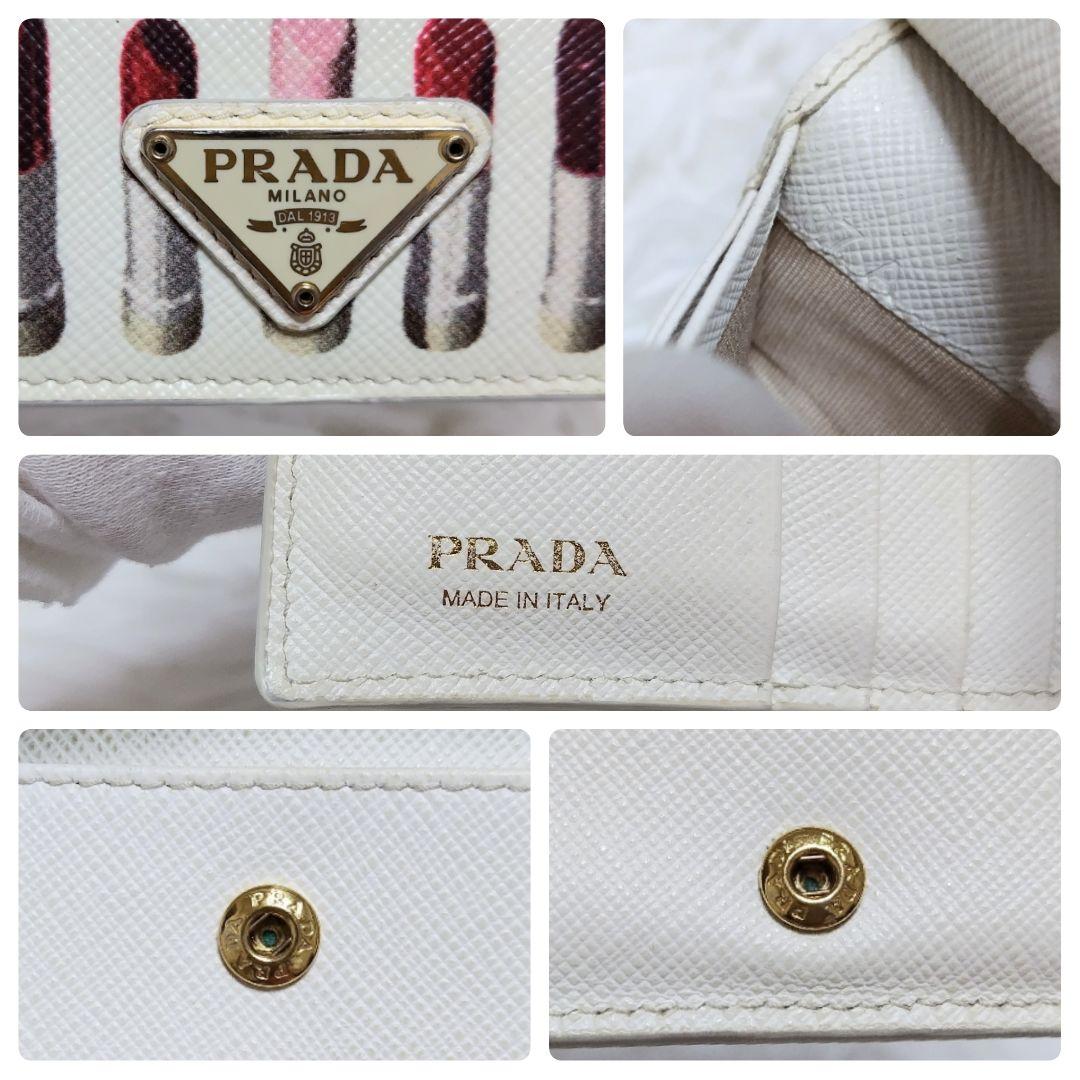 レア美品✨プラダ◇リップ柄プリント二つ折り財布　三角ロゴゴールド金具ホワイト
