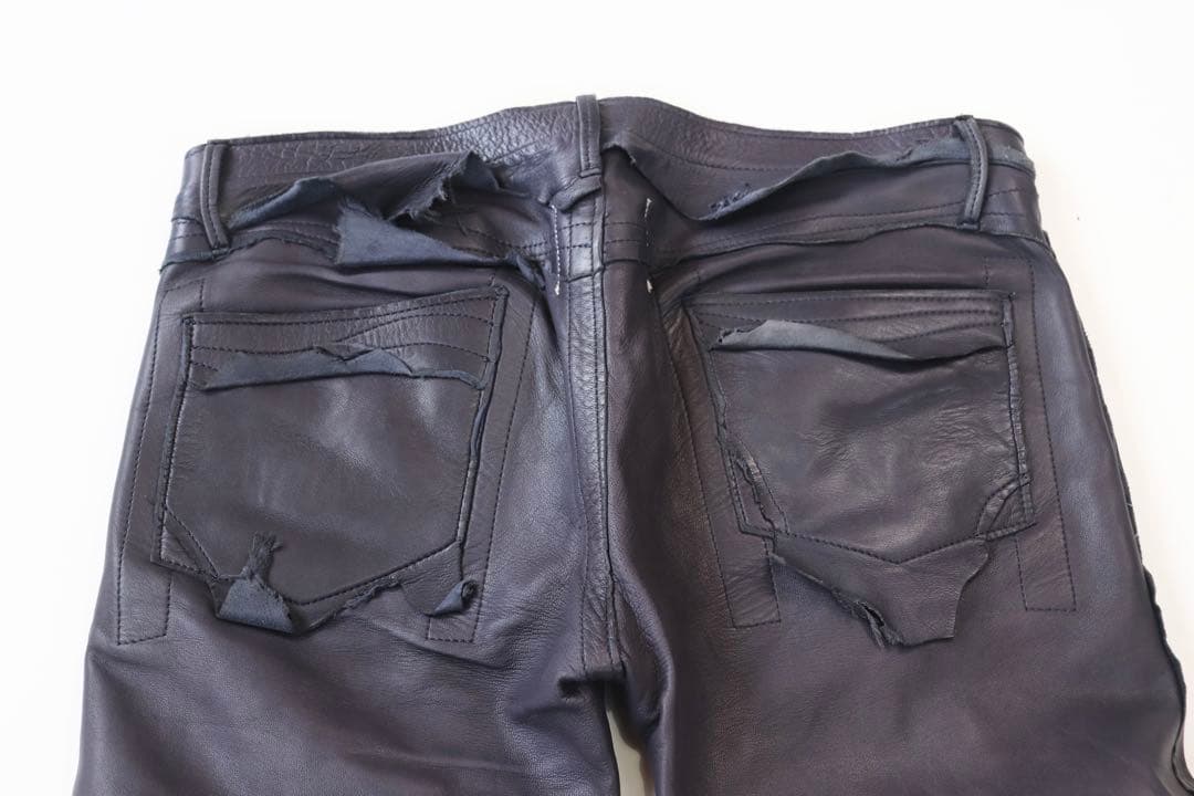 ソロイストラフアウトレザーパンツネイビー46中古品裏地破れあり