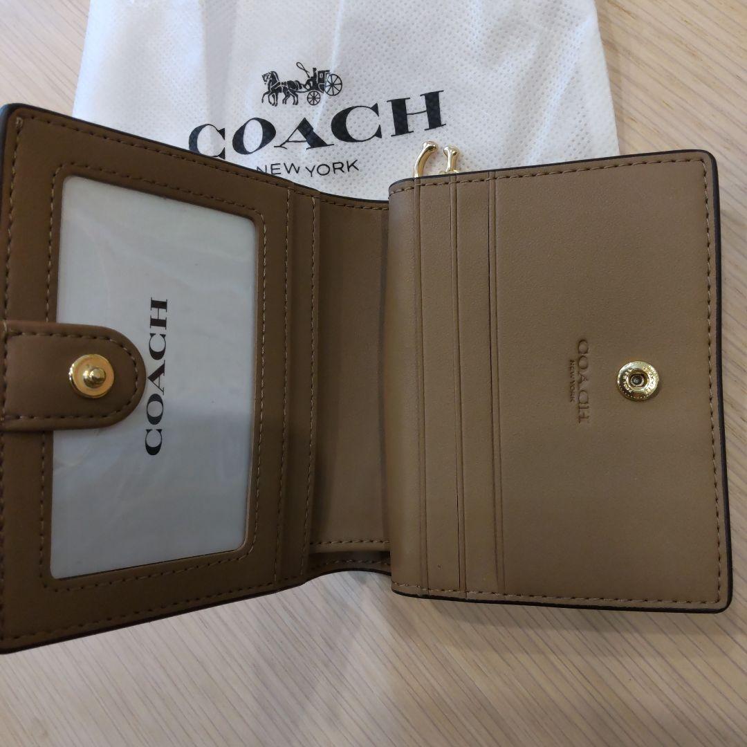 専用です！　お値下げしました。新品未使用！COACH ベージュ系 二つ折り財布