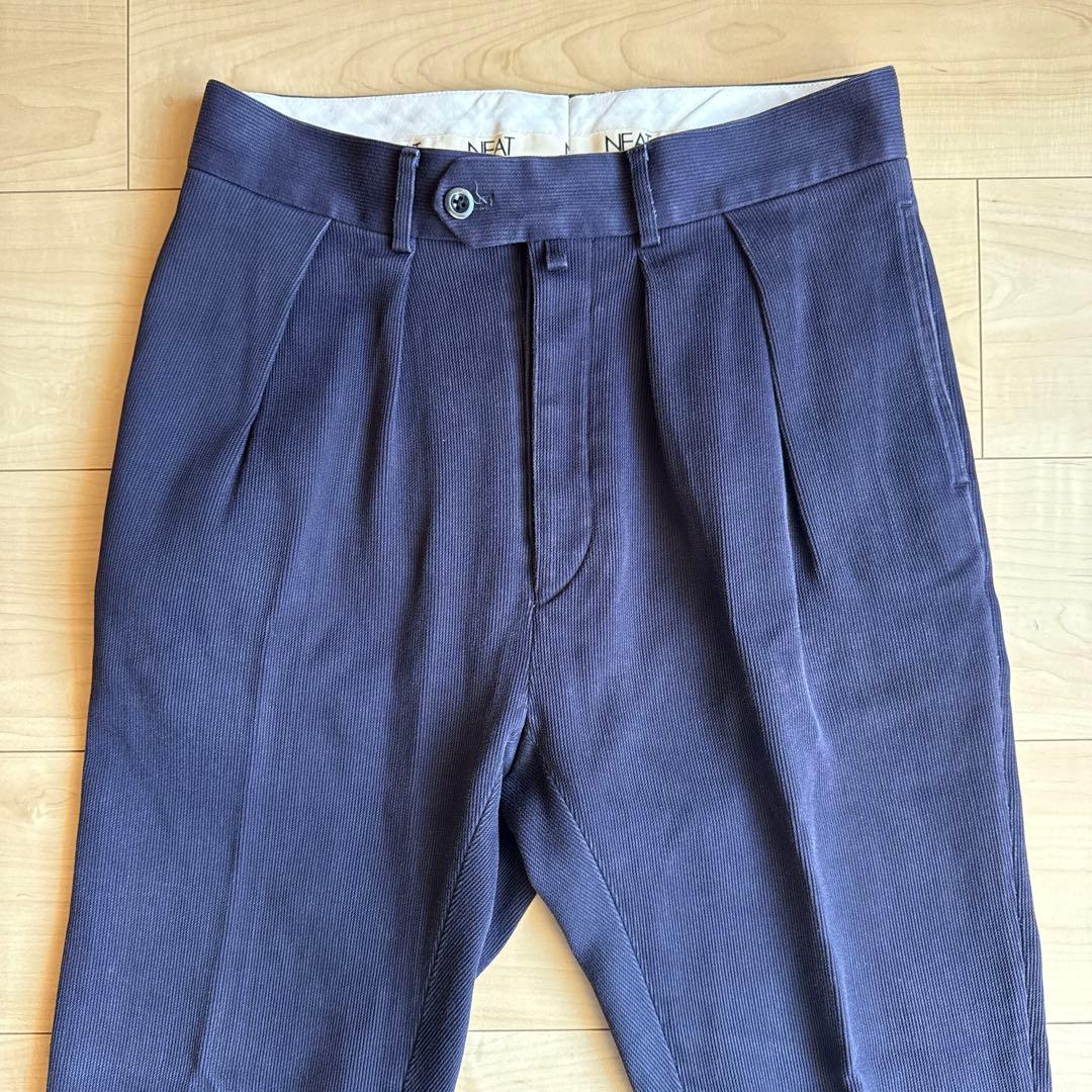 パンツ NEAT COTTON PIQUE TAPERED PANTS