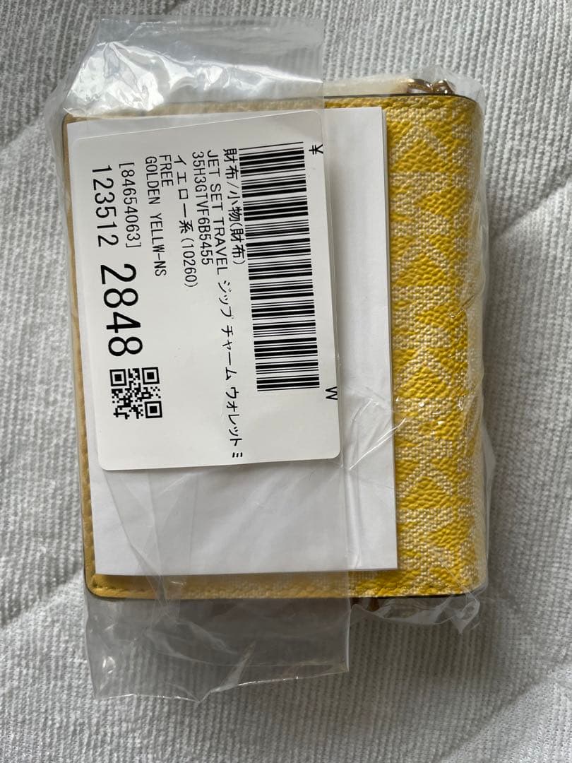 マイケルコース新品未使用二つ折り財布値下げできない