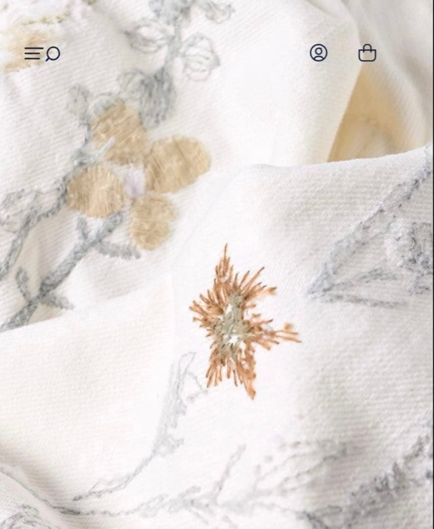 45R ライ麦ホワイトデニムのクロスオーバーパンツ遖加工（アネモネ刺繍）