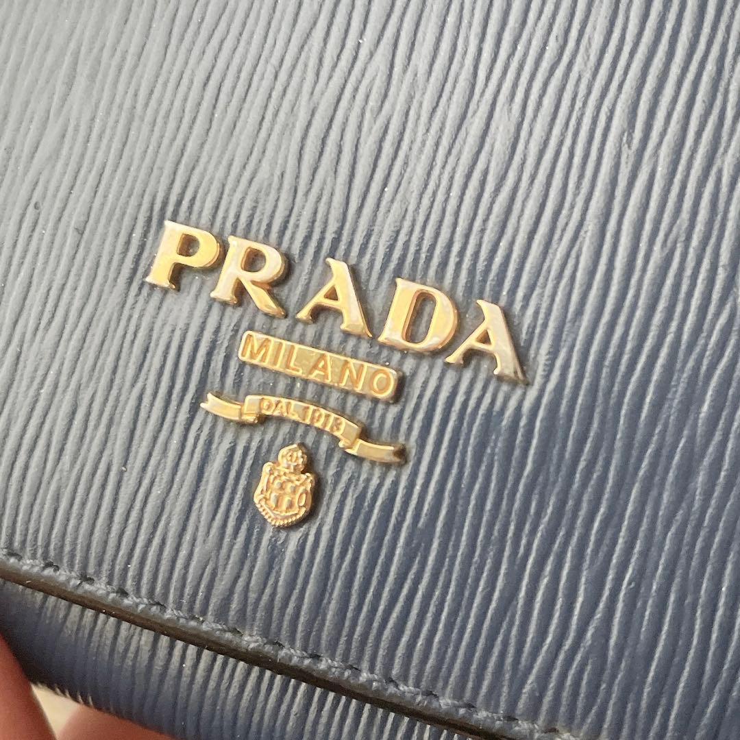PRADA カーフレザー ネイビー ロゴ金具 三つ折り 財布 ギャランティー