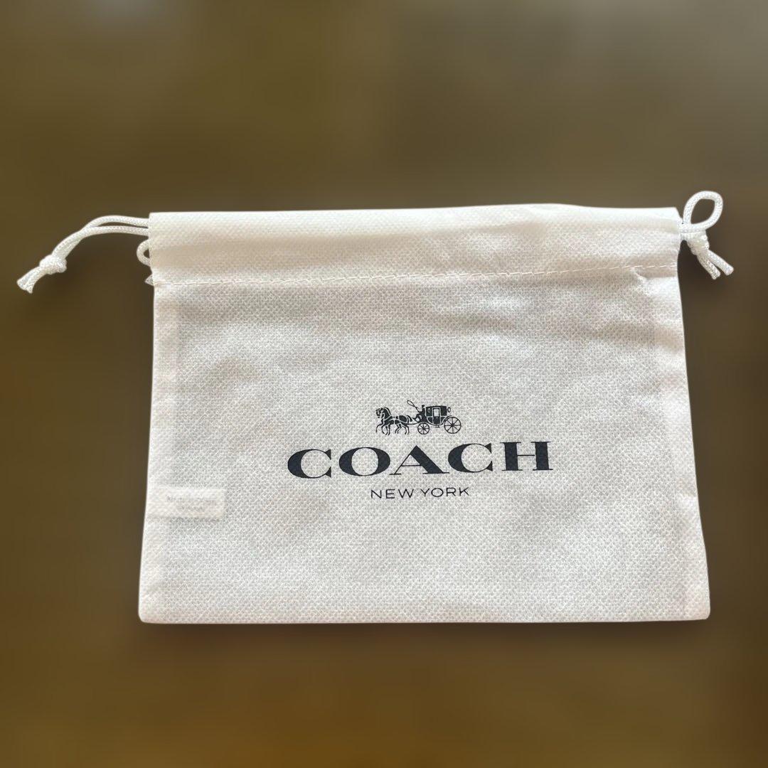 【新品未使用】COACH コーチ 二つ折り財布 シグネチャー チャーム付 茶