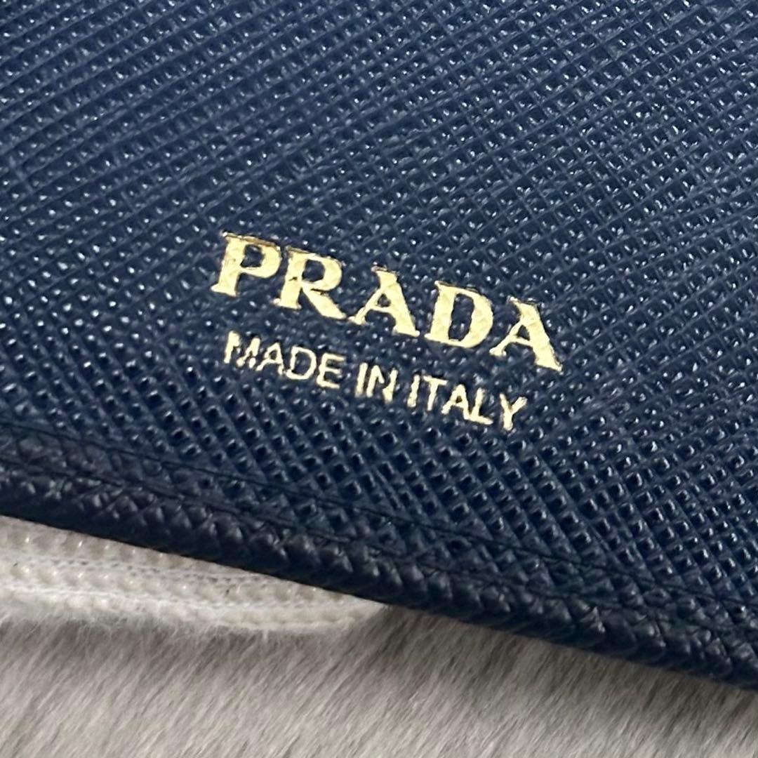 PRADA 折り財布　ゴールドロゴ　ブルー　ラウンドジップ　サフィアーノレザー
