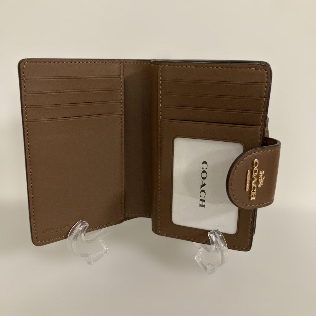 〔新品　未使用〕COACHコーチ　シグネチャー 二つ折り財布