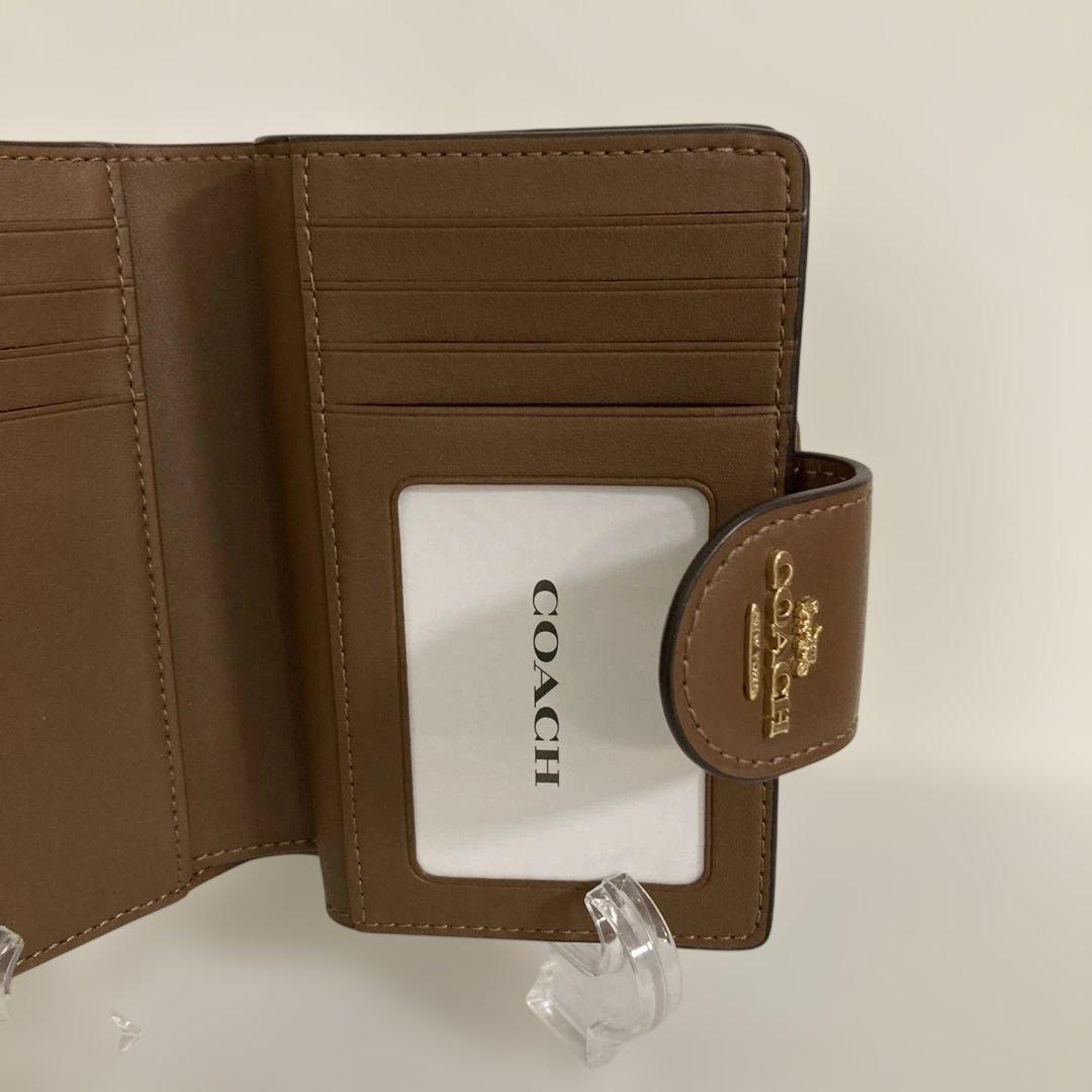 〔新品　未使用〕COACHコーチ　シグネチャー 二つ折り財布