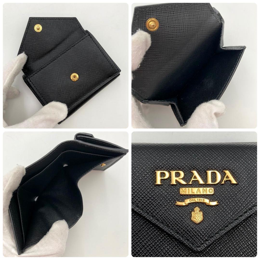 とーもー✨PRADA 三つ折り財布 黒 サフィアーノレザー メタルロゴ