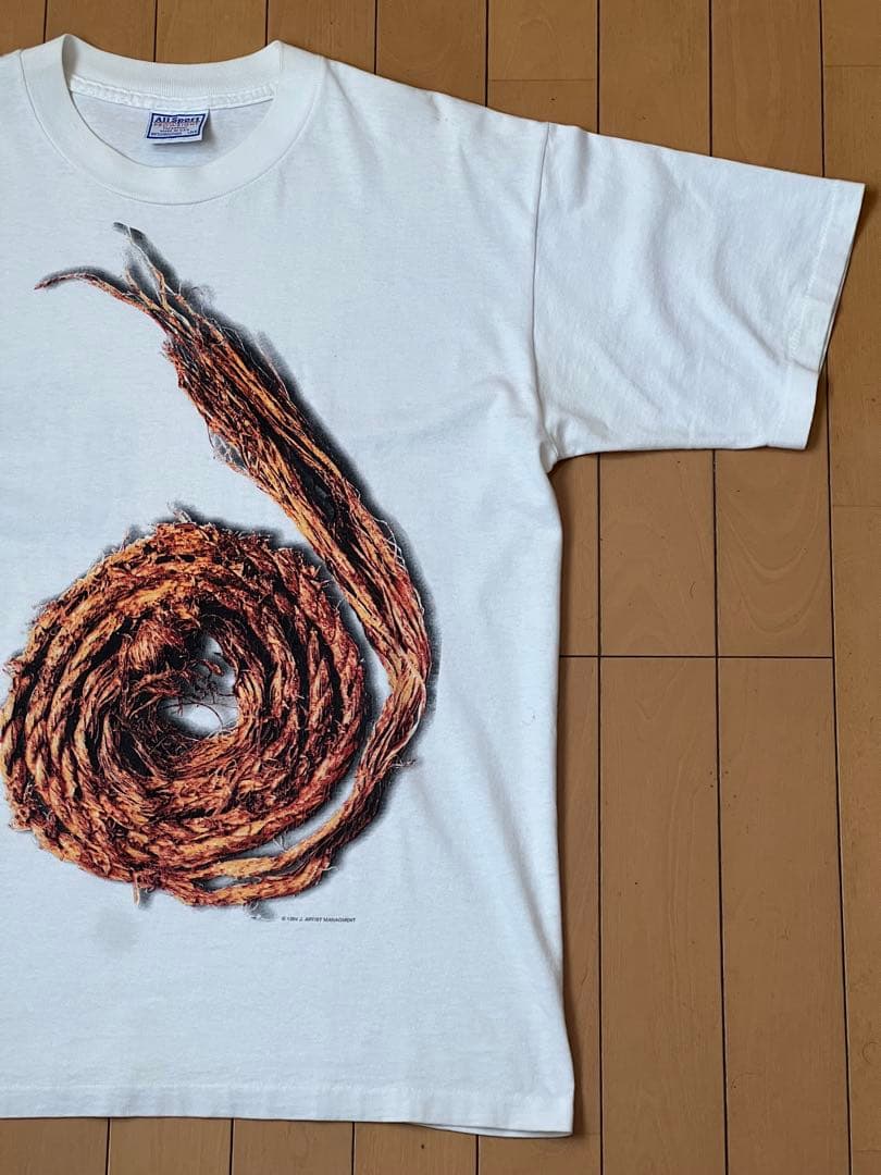 トップス FURTHER DOWN THE SPIRAL