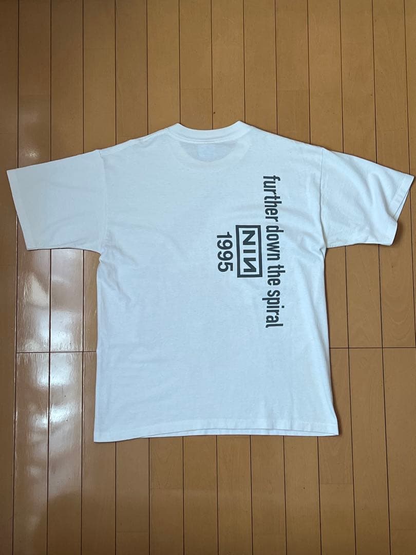 トップス FURTHER DOWN THE SPIRAL