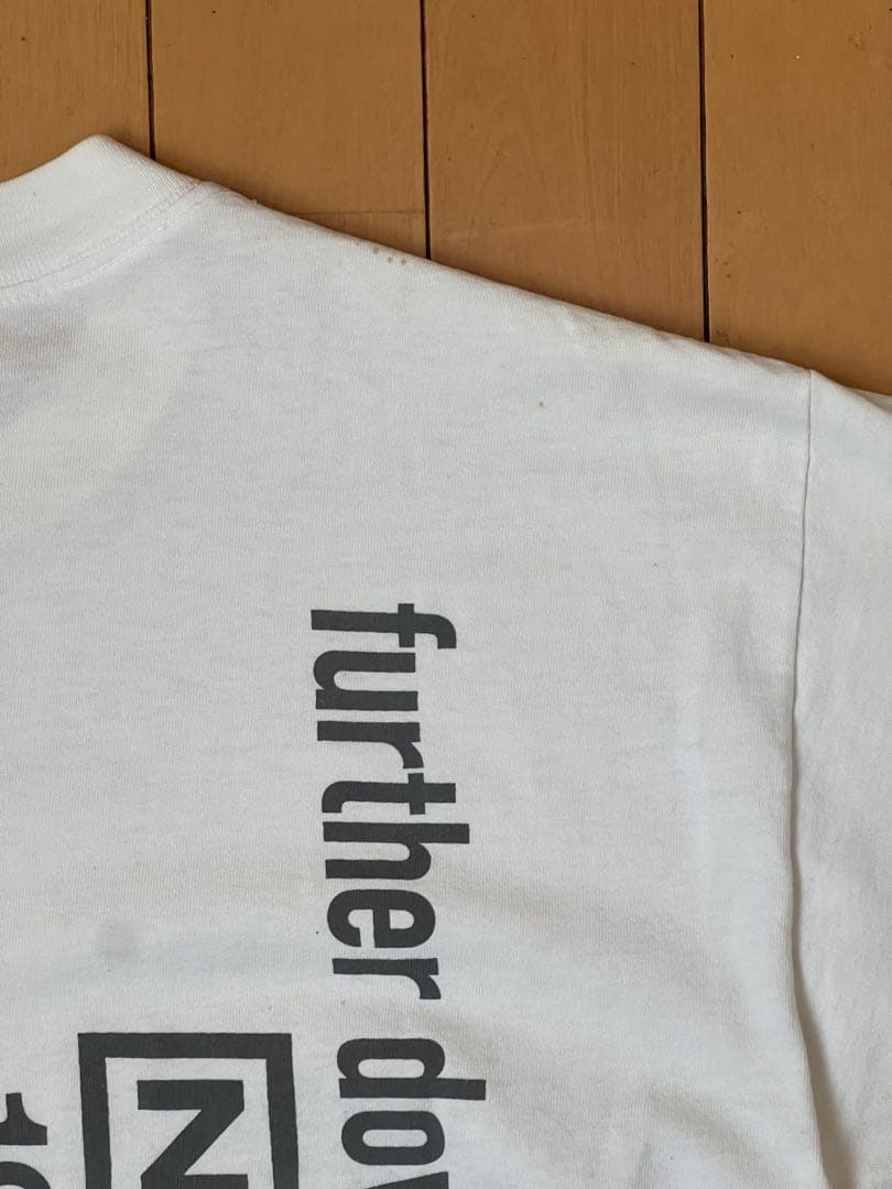 トップス FURTHER DOWN THE SPIRAL