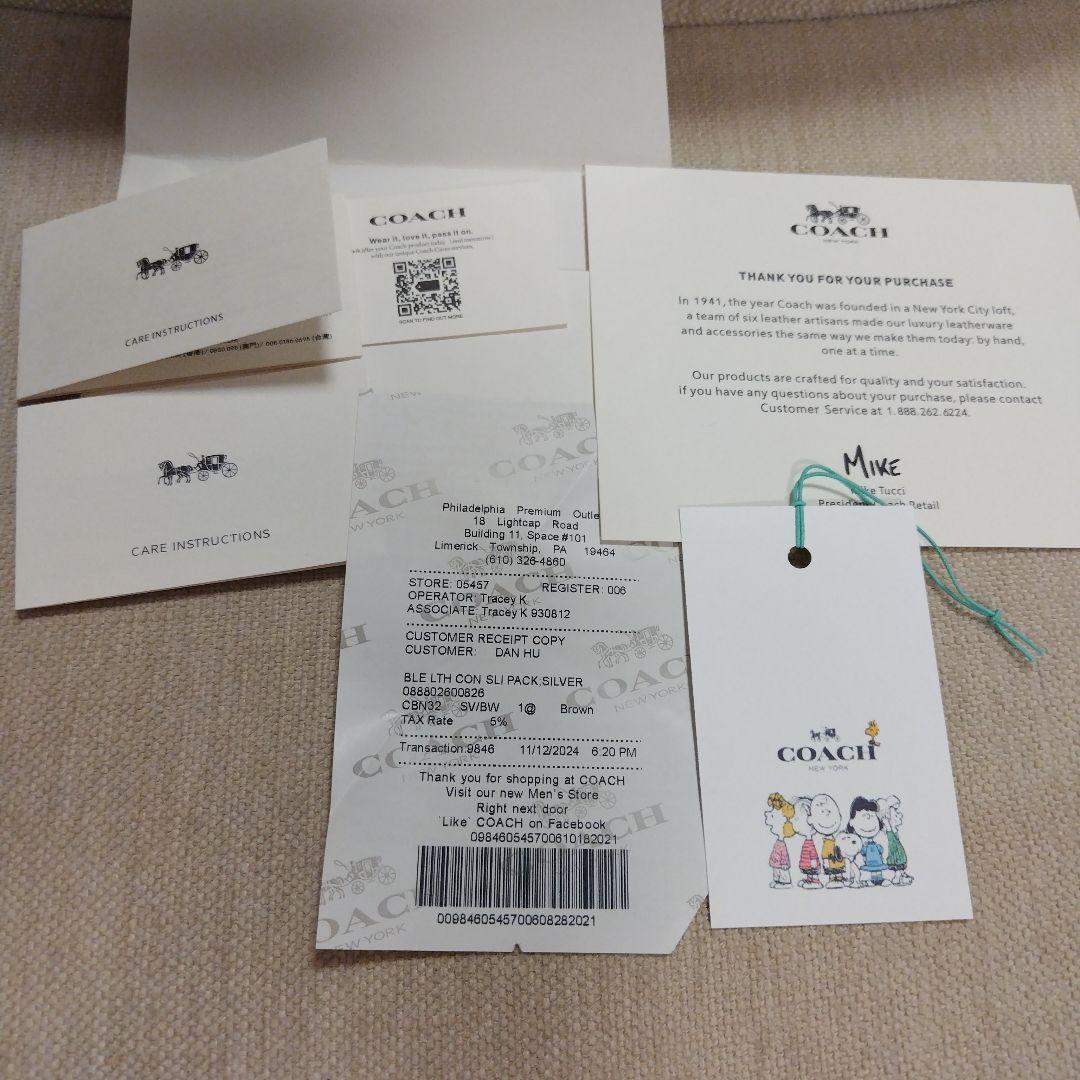 専用です。COACH スヌーピー 二つ折り財布