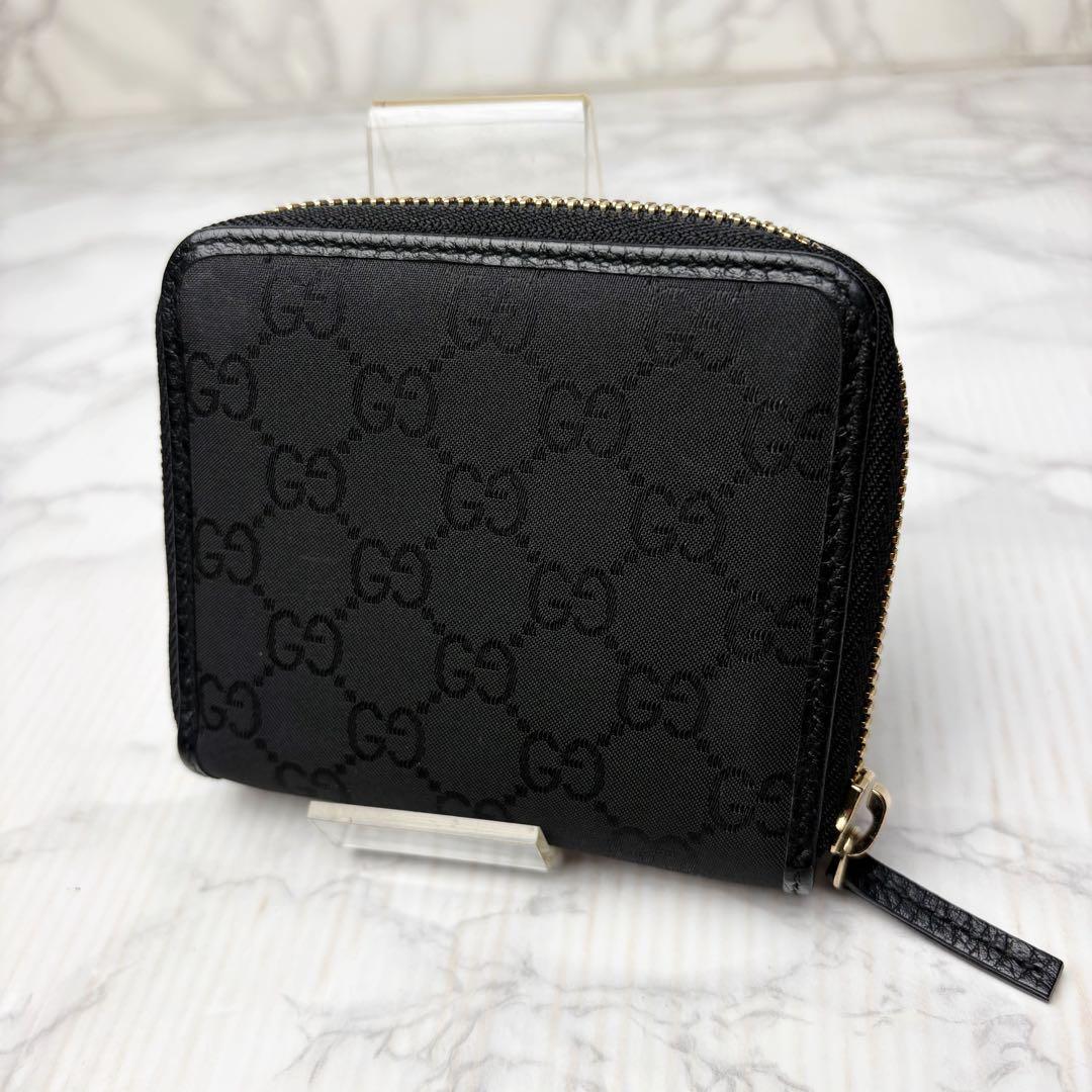 08 未使用級 GUCCI 二つ折り財布 ラウンドファスナー 黒 mg5