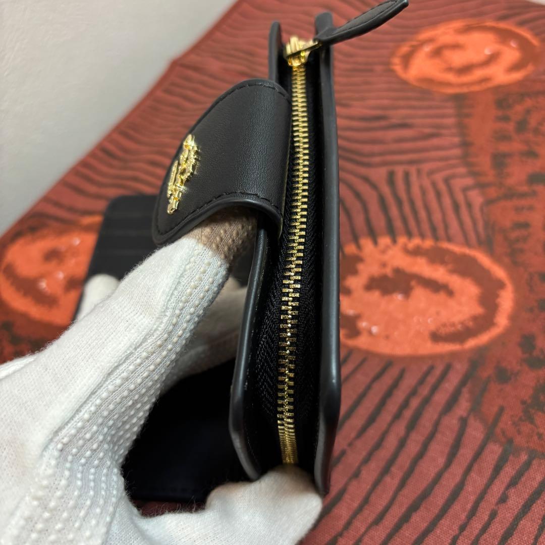 【美品】COACHコーチ 二つ折り財布 シグネチャー ブラウン
