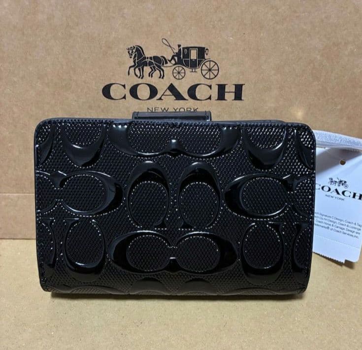 【オープン価格】COACH シグネチャーエンボス加工 二つ折り財布
