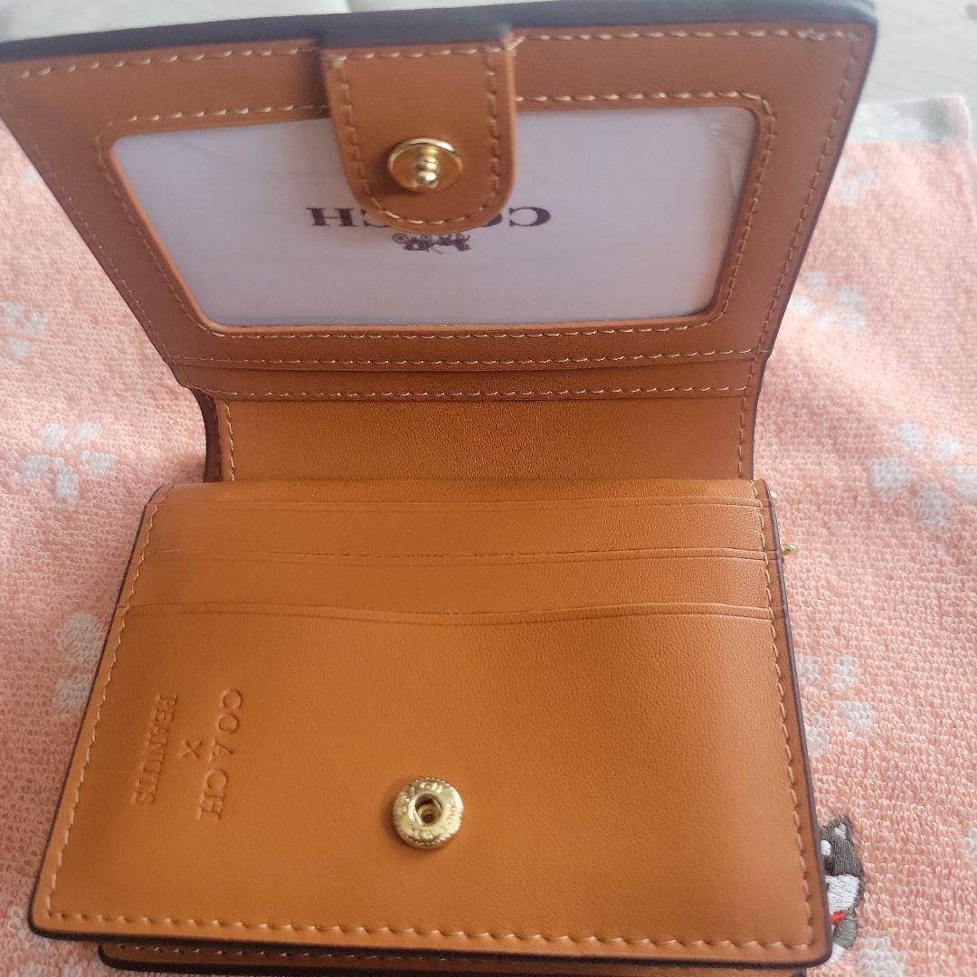 COACHコーチシグネチャースヌーピーコラボ二つ折り財布
