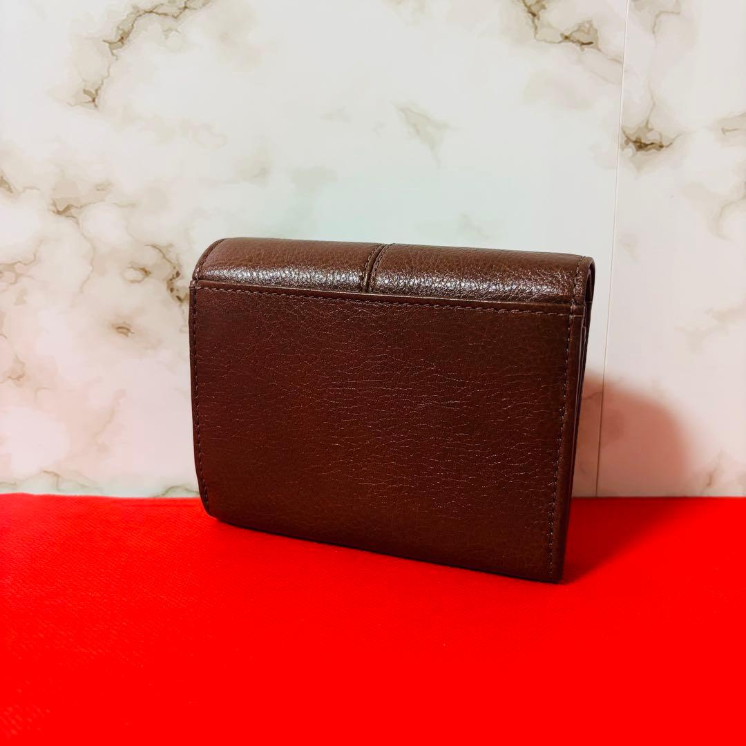 0077 新品、未使用 COACH レザー 金馬車ロゴ 折り財布