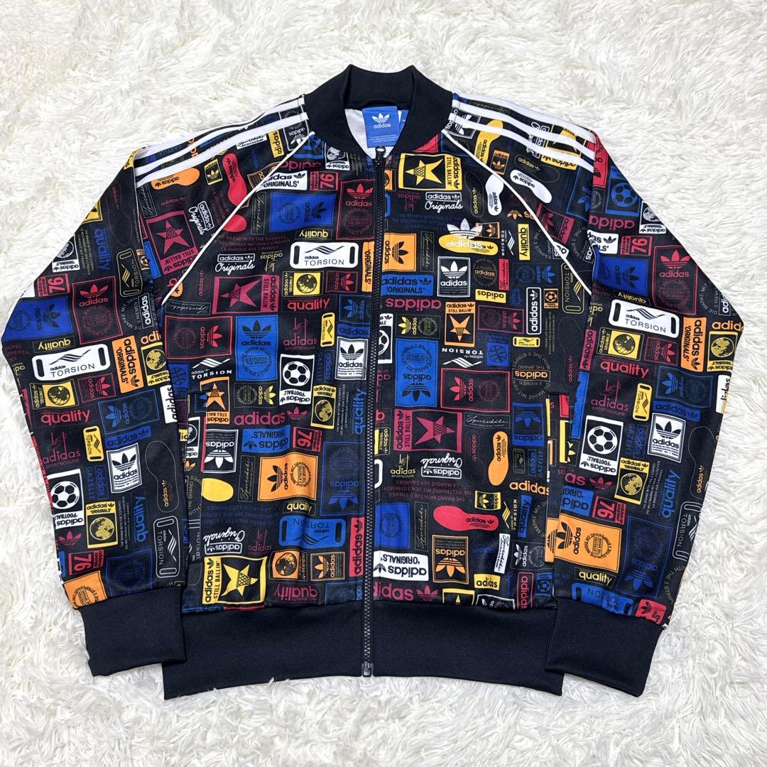 ゴージャス アディダス adidas(L)トラックジャケット 総柄 トレフォイル