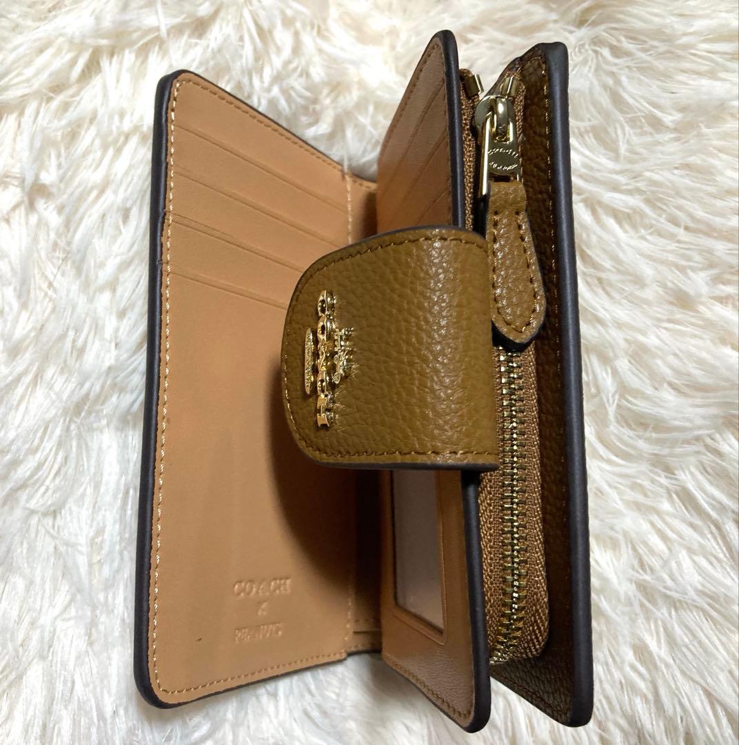新品未使用コーチ二つ折り財布COACH×PEANUTSスヌーピーホワイト