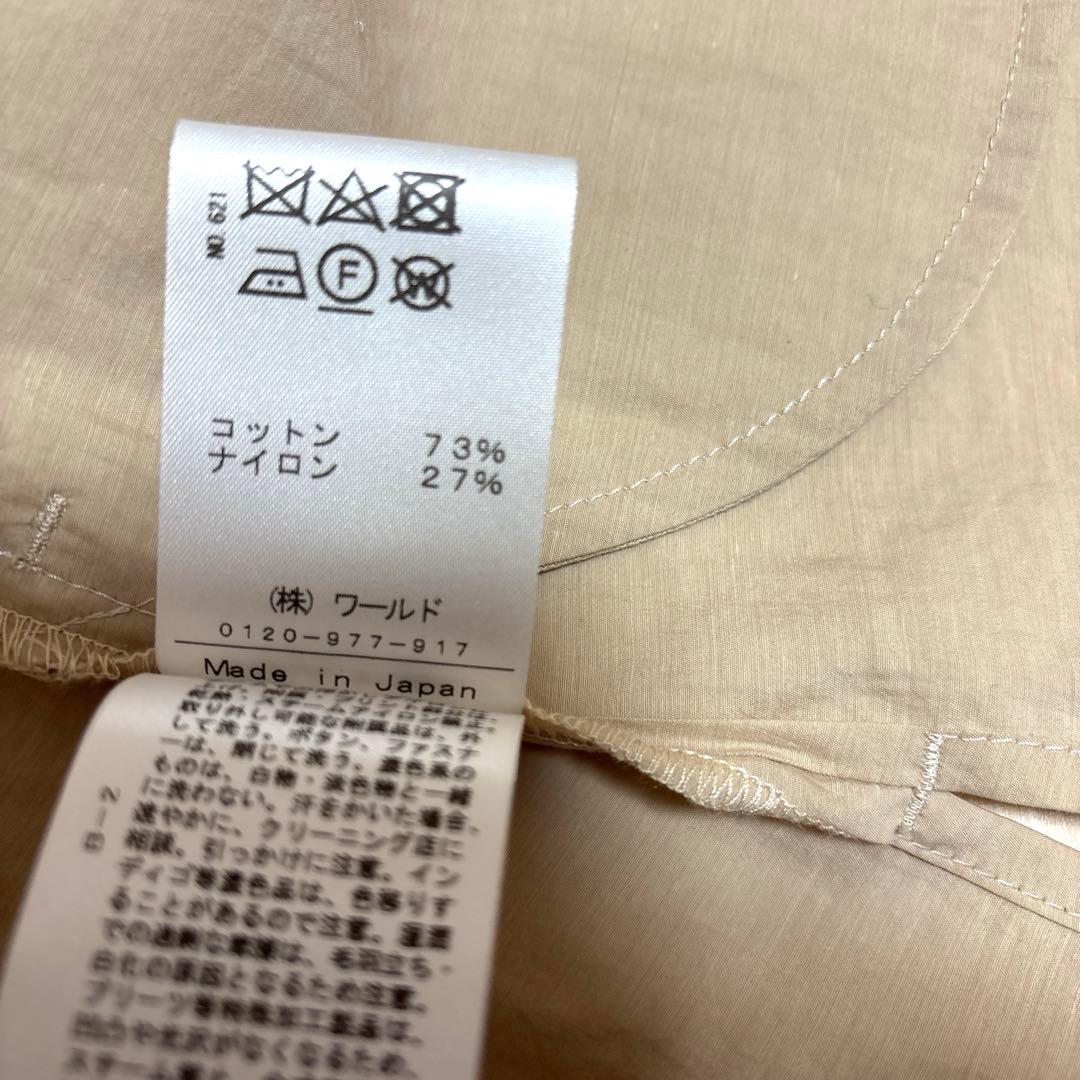 [美品]ドレステリア ノーカラーエアリーコート ベルトリボン スリット 38