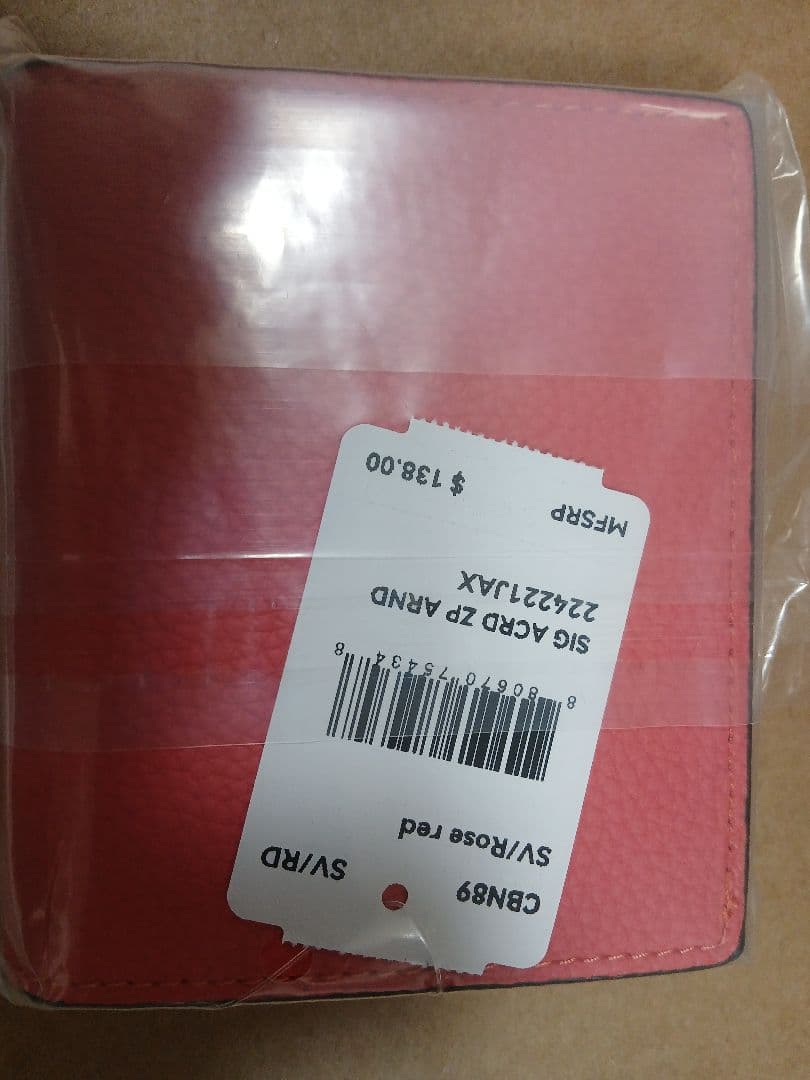 新品・未使用COACHコーチ ルーシースヌーピー 二つ折り財布 ピンク