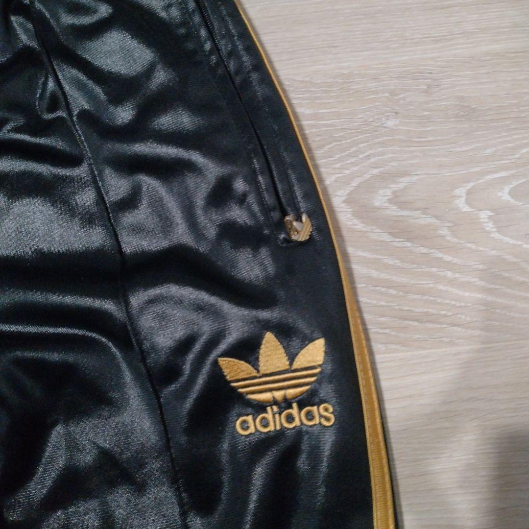adidas コーティングジャージ上下セット 黒×金