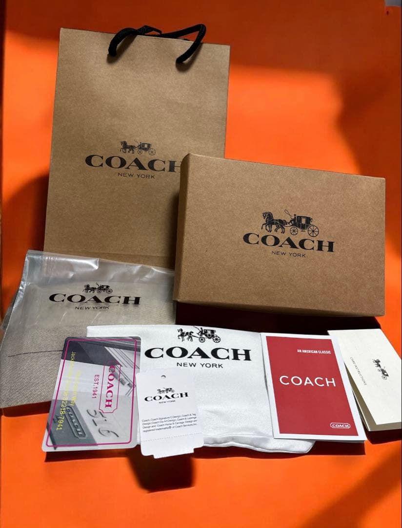 《新品》COACH 二つ折り財布ピンク/ベージュ新品