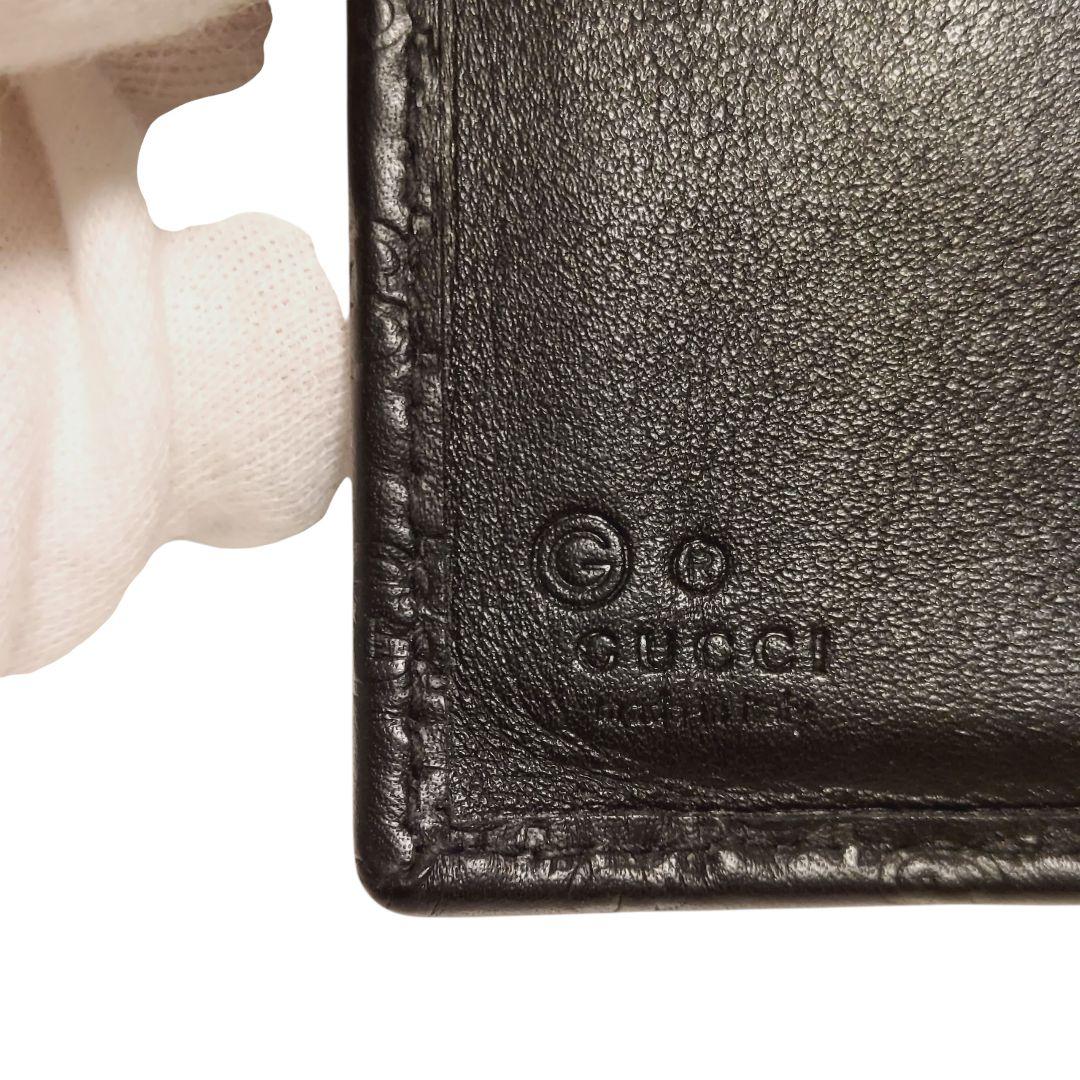 【GUCCI】2つ折り財布 黒 マイクロ レザー 型押し