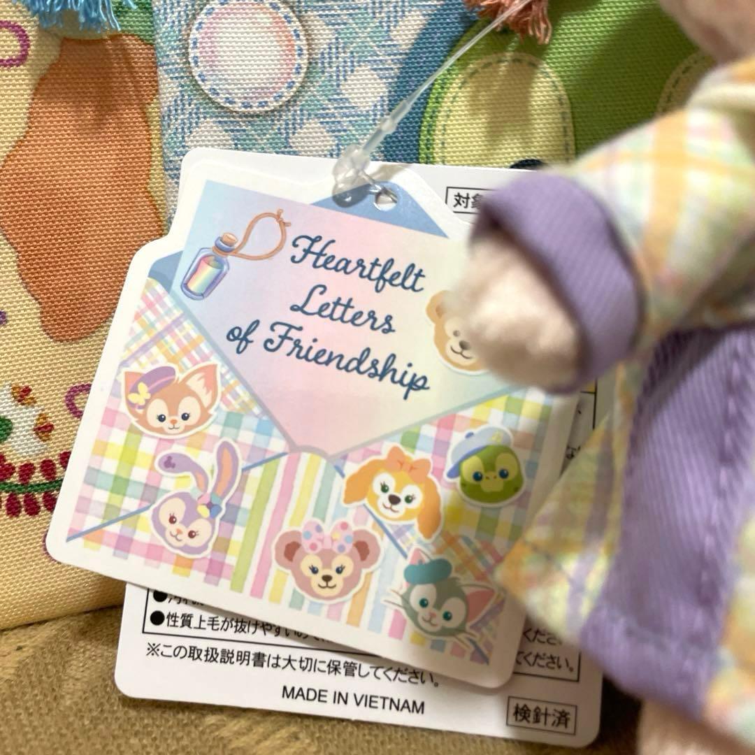 ディズニー　ダッフィー２０周年きんちゃく５枚　➕リーナベルぬいぐるみバッジ計６点