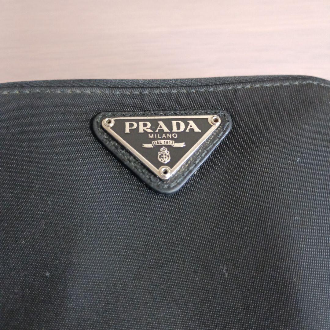 PRADA プラダ二つ折り財布ナイロン ラ ウンドジップ サフィアーノ 三角ロゴ