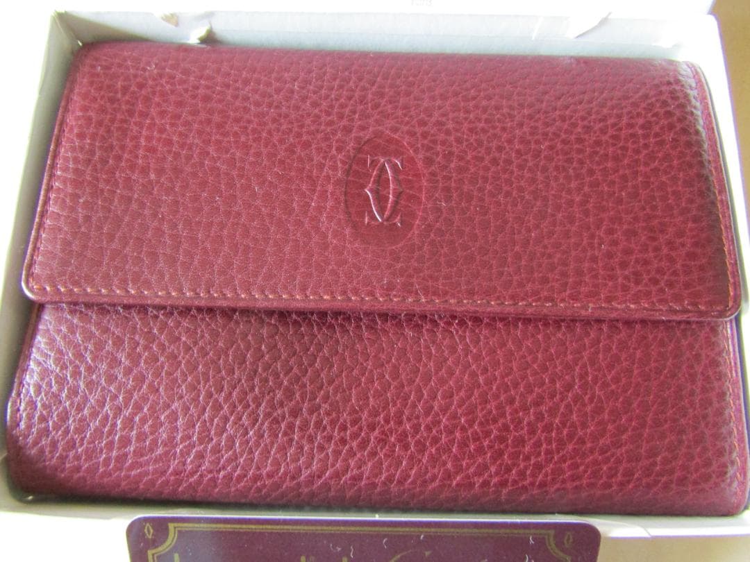 k*5様 カルティエ　Cartier バーガンディ 三つ折り財布　未使用品