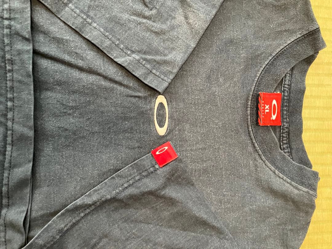 ビンテージoakley オークリーTシャツ　XL サロモン　フェイド日焼け墨黒