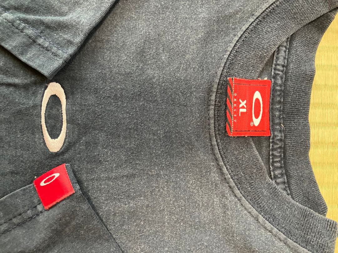 ビンテージoakley オークリーTシャツ　XL サロモン　フェイド日焼け墨黒