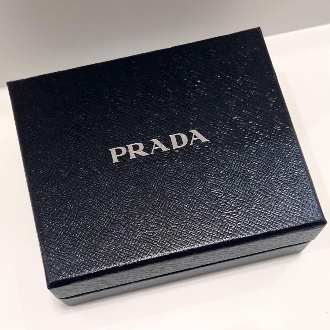 プラダ 折り財布 サフィアーノ レザー ゴールド金具 ピンク 白 バイカラー