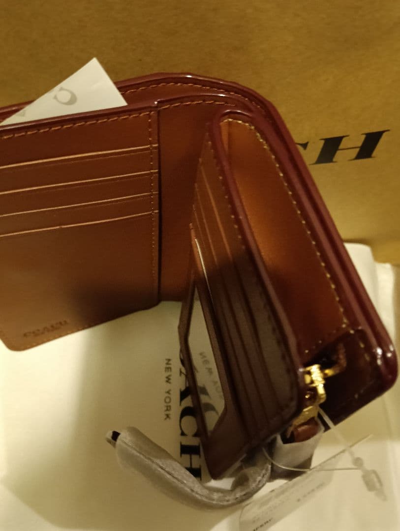 COACH 花柄 二つ折り財布　ショッパー