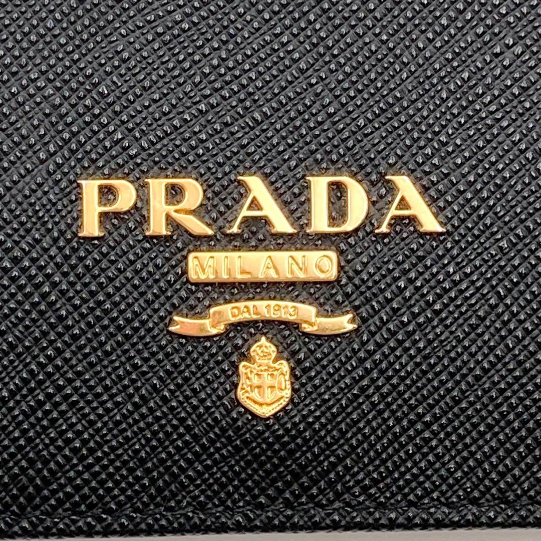 ホタテ✨ PRADA 1MV204 二つ折り財布 黒 サフィアーノレザー