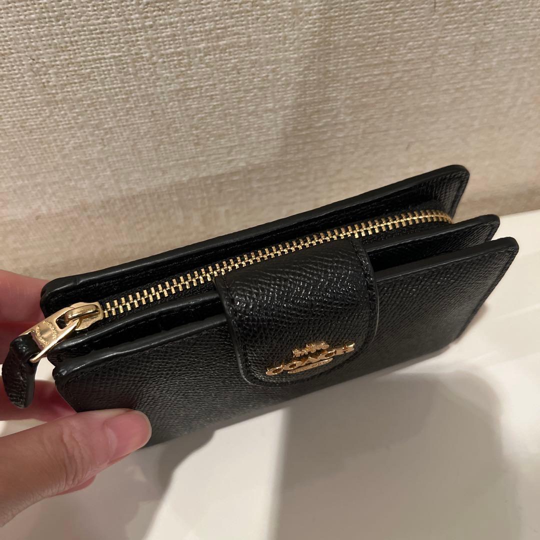 COACH 二つ折り財布　さくらさくらこです。