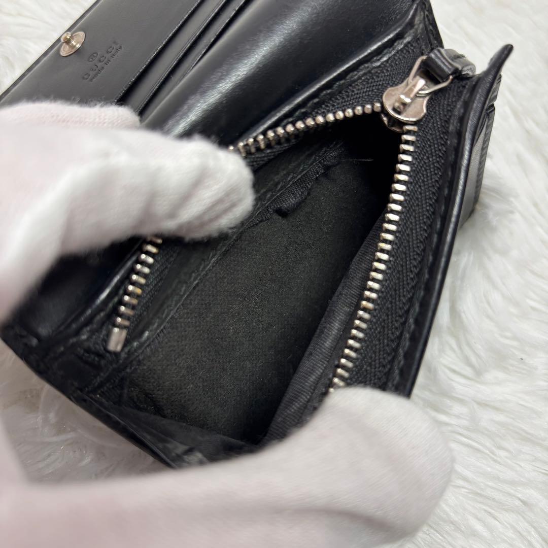 ✨高級✨ グッチ 二つ折り財布 シマ ドリアン GG柄 レザー シグネチャー 黒