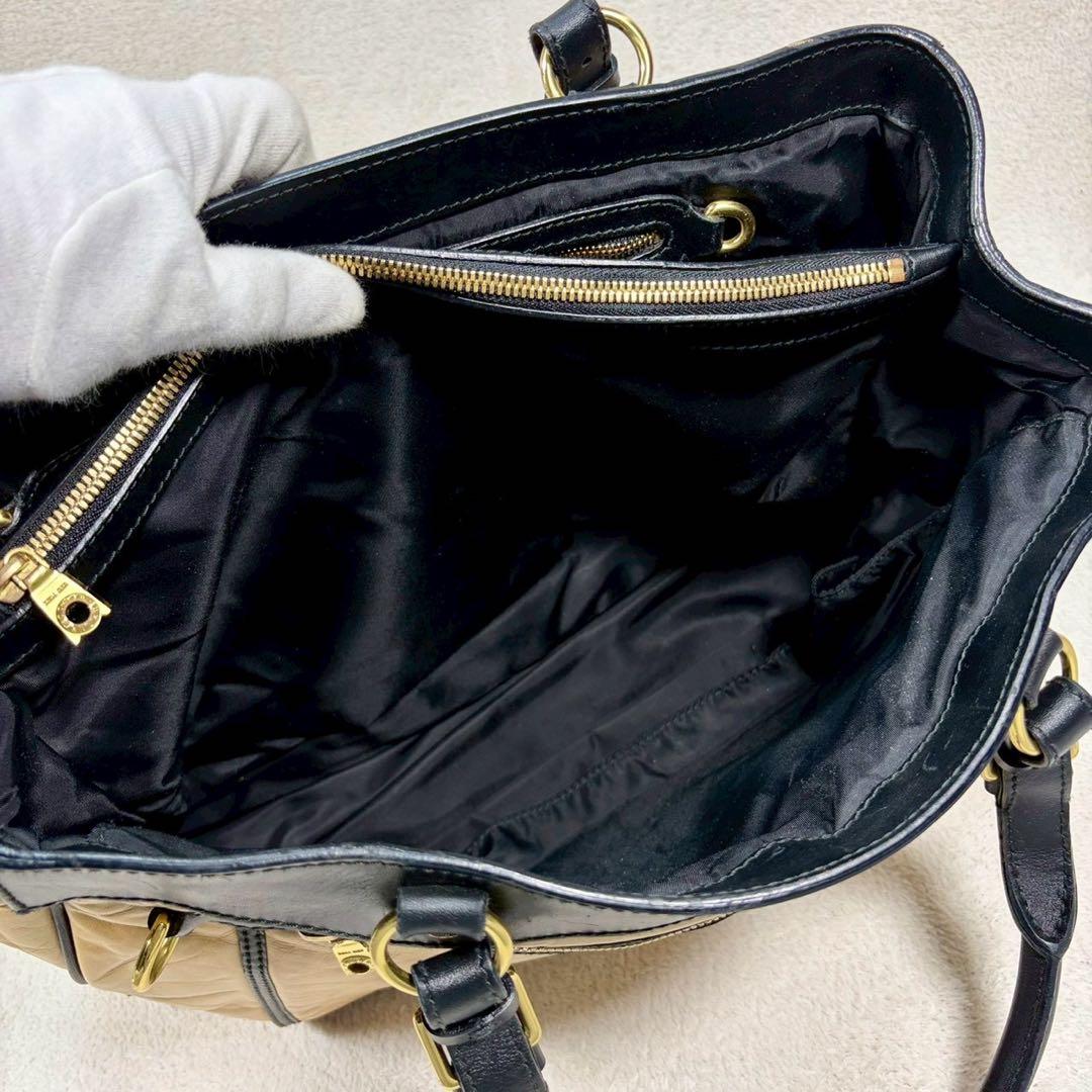 【美品✨】ハンティングワールド　黒 ベージュ　レザー　ヴィンテージ　金具　ロゴ