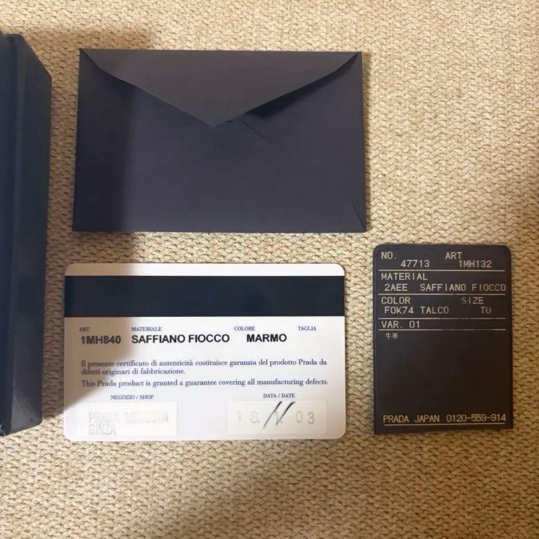 外箱/保証書付き PRADA ミニ財布 サフィアーノレザー リボン