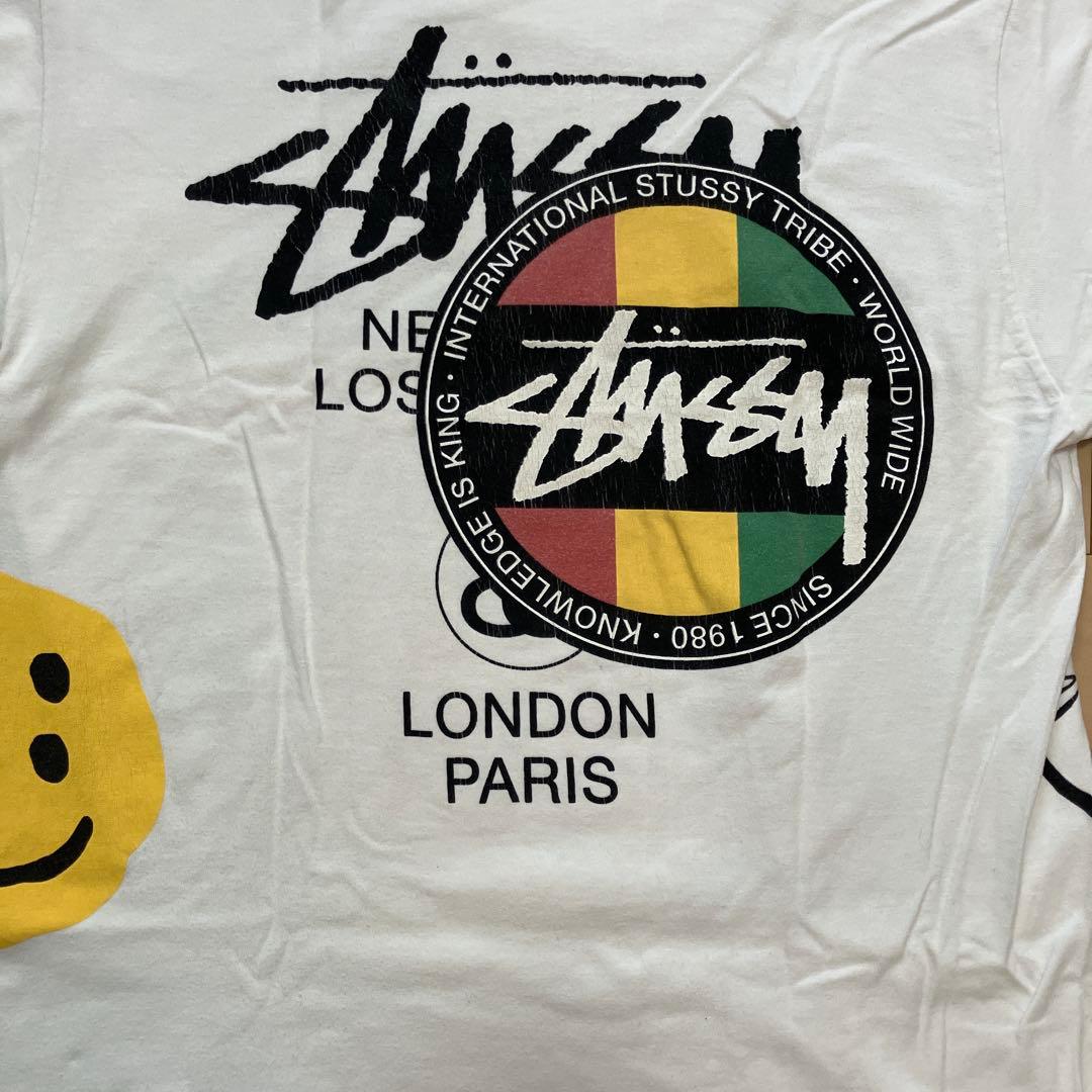 ステューシーSTUSSY×CPFM 限定コラボ ラスタ プリントTシャツ 白 L