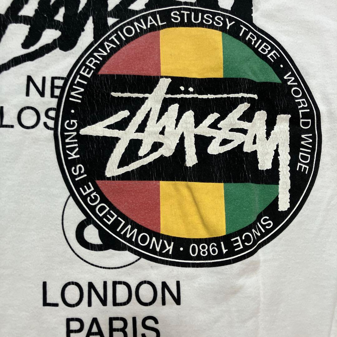 ステューシーSTUSSY×CPFM 限定コラボ ラスタ プリントTシャツ 白 L