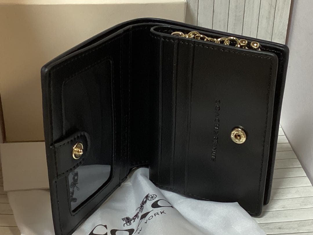 新品保存袋付きコーチスヌーピーCOACH 二つ折り財布ケース本物ラウンド