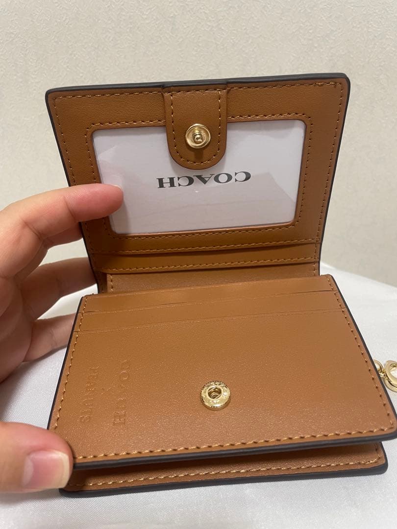 コーチ　レディース　折財布　小銭入れあり　カキー　スヌーピー　新品　未使用