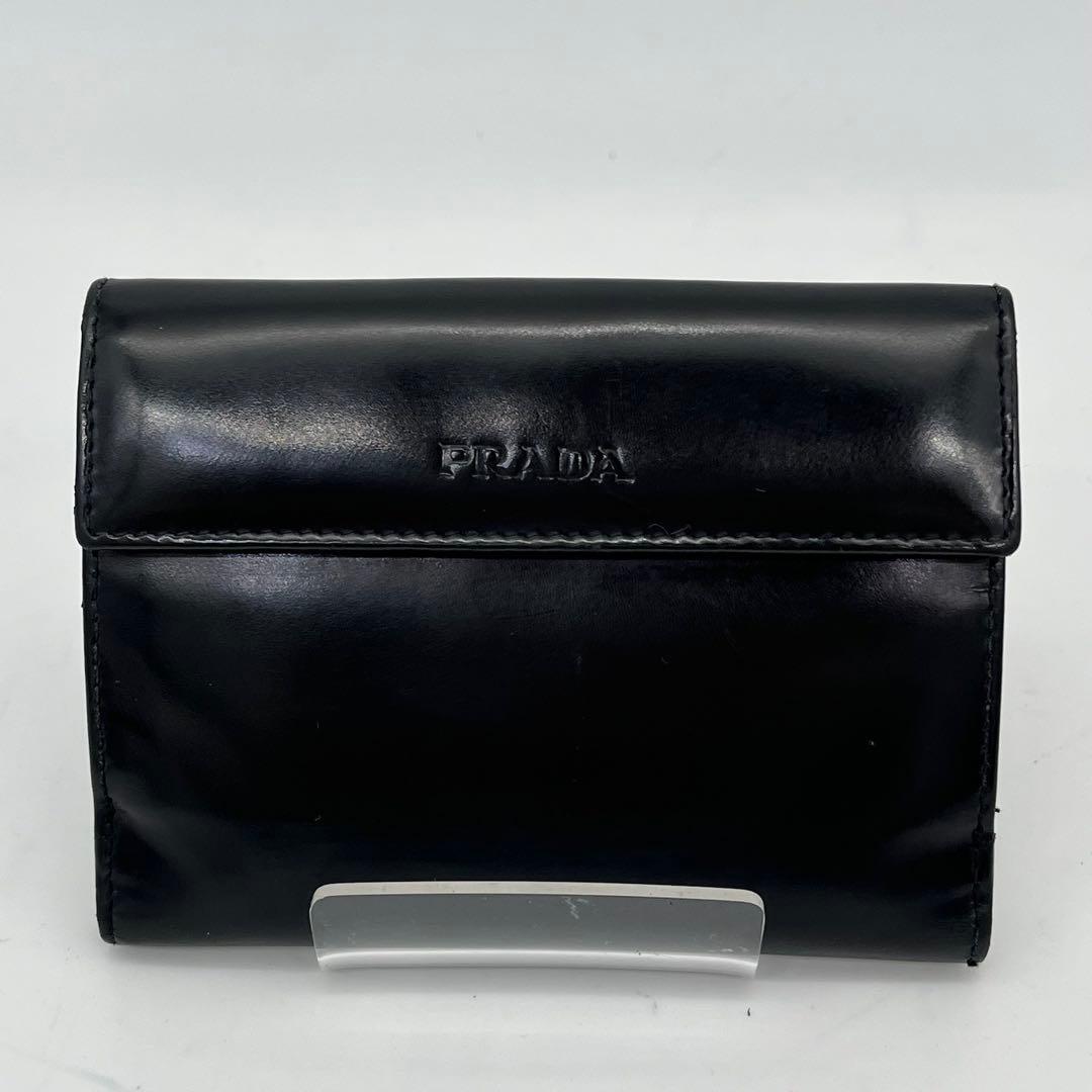 PRADA 二つ折り財布 ロゴ型押し ブラック エナメル 付属品付き 男女可能