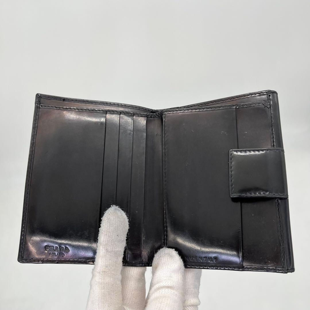 PRADA 二つ折り財布 ロゴ型押し ブラック エナメル 付属品付き 男女可能