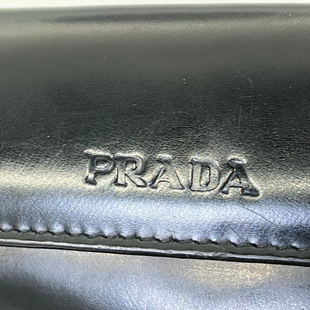 PRADA 二つ折り財布 ロゴ型押し ブラック エナメル 付属品付き 男女可能