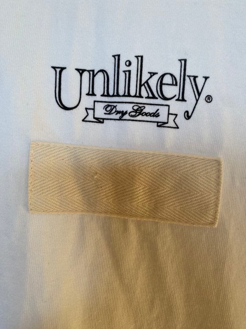 トップス Unlikely Team Tee